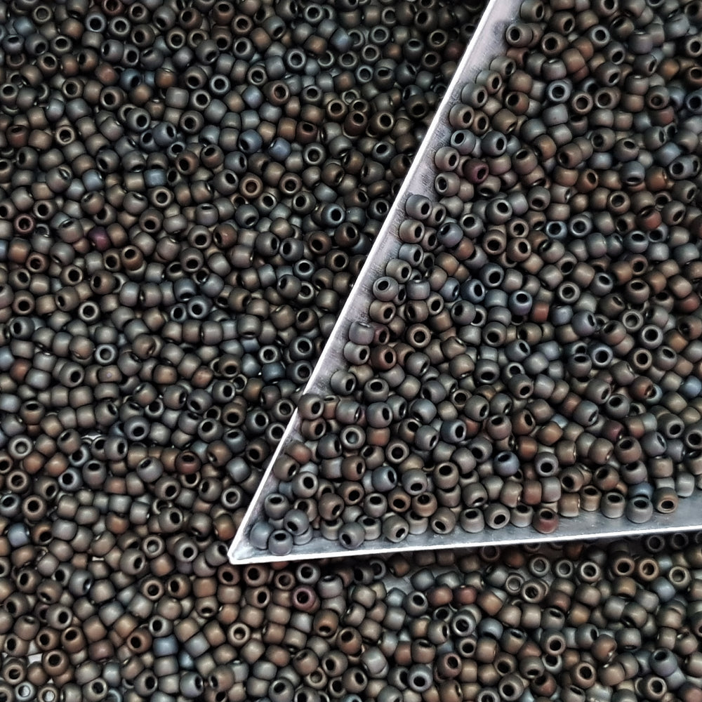 11/0 Toho Seed Beads in Iris Brown Metallic Frosted TR-83F with a triangle scoop.