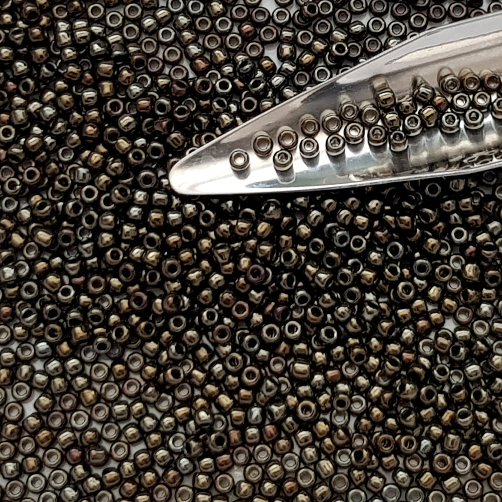 11/0 Toho Seed Beads in Iris Brown Metallic with beading scoop.