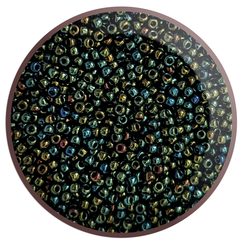 11/0 Toho seed beads in Iris Green/Brown Metallic TR-84 in a circle white background.