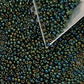 11/0 Toho Seed Beads in Iris green/brown TR-84 with triangle scoop.