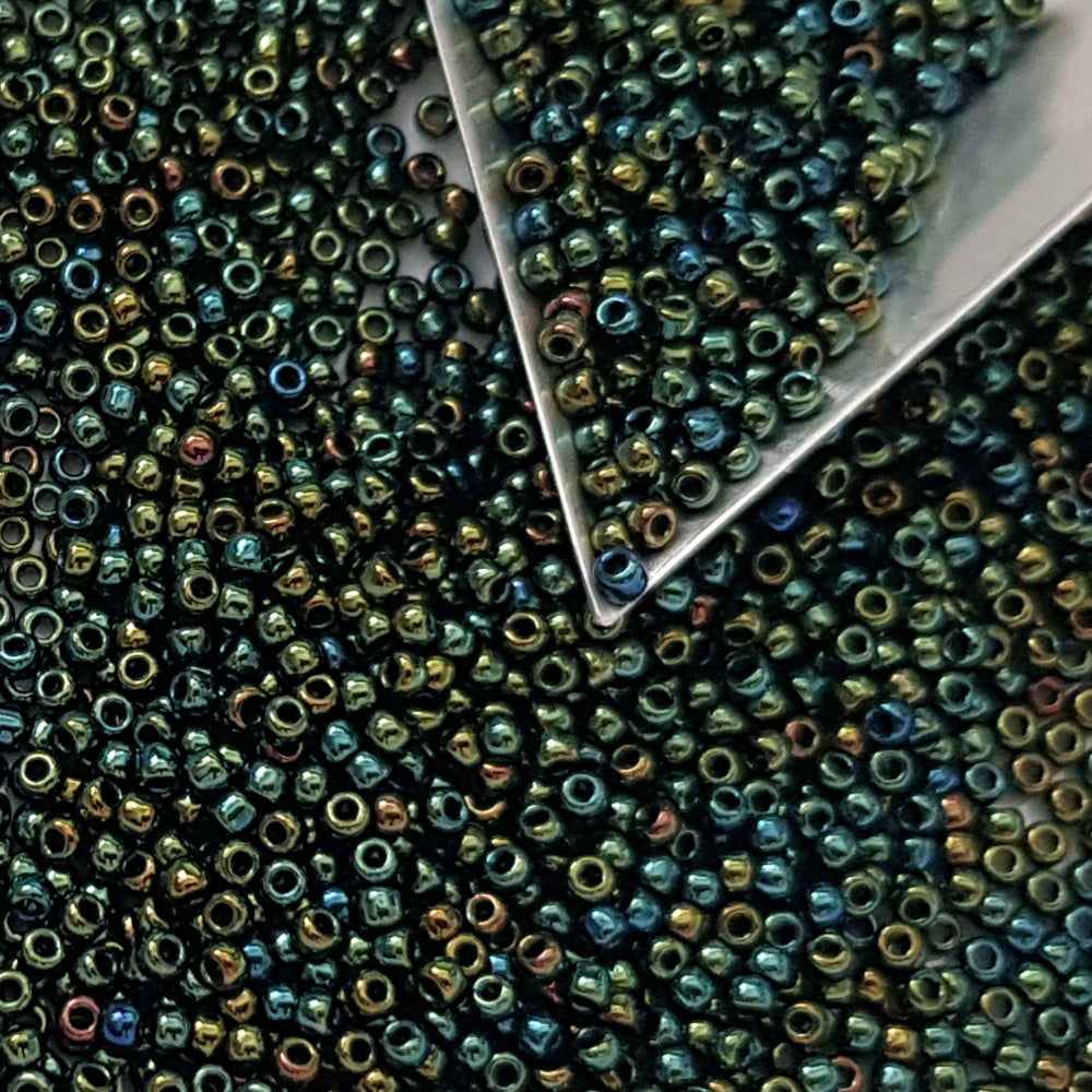 11/0 Toho Seed Beads in Iris green/brown TR-84 with triangle scoop.