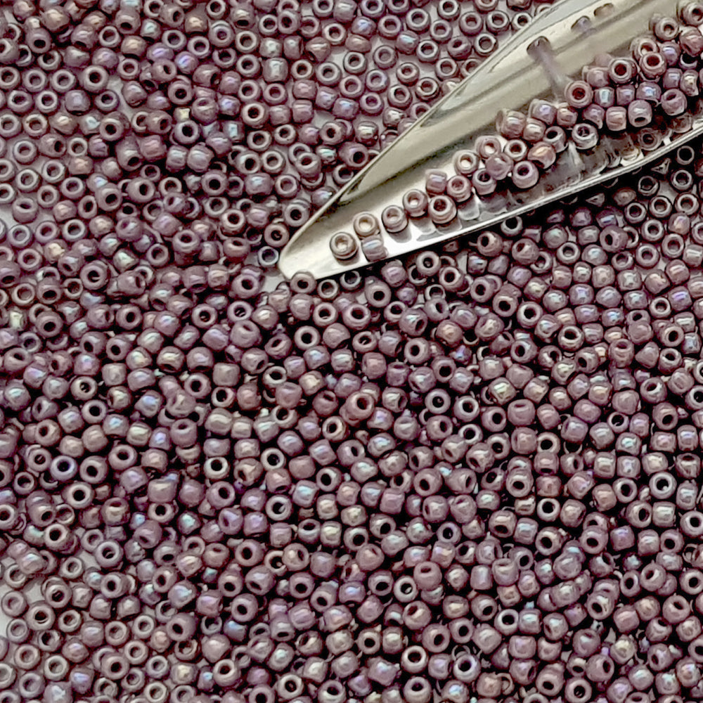 11/0 Toho Seed Beads in lavender rainbow opaque with a beading scoop