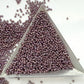 11/0 Toho Seed Beads in lavender rainbow opaque with a triangle scoop.