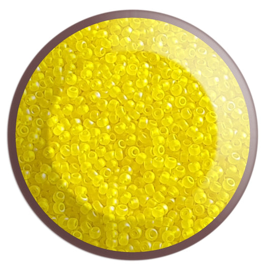 11/0 TR-175F Lemon Rainbow Matte Round Toho Seed Beads in a circle white background.