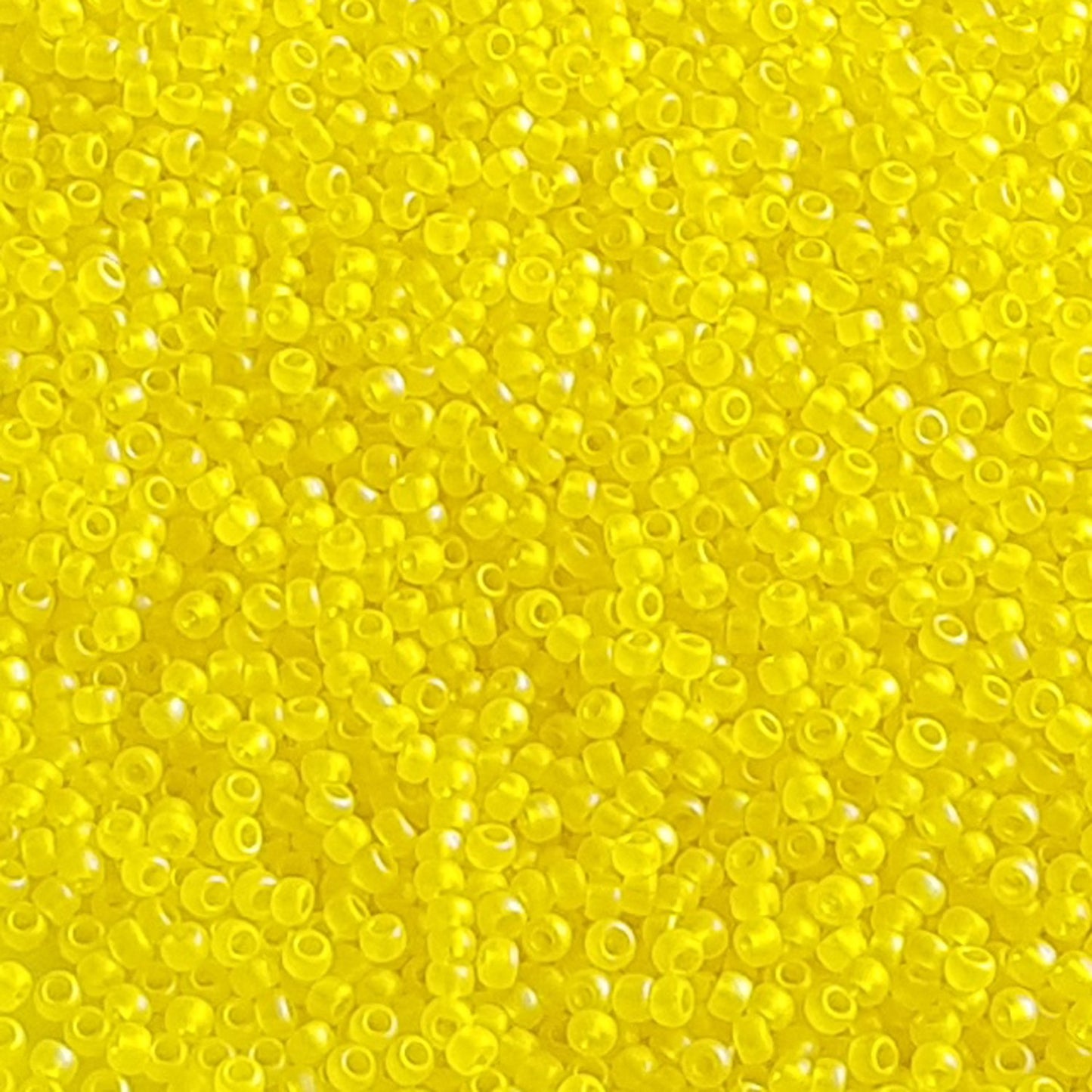 11/0 TR-175F Lemon Rainbow Matte Round Toho Seed Beads close up.