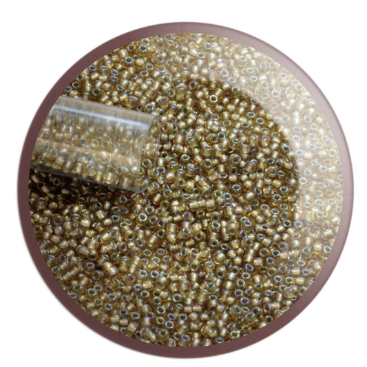 11/0 TR-279 Light Topaz Rainbow Grey Lined Round Toho Seed Beads - circle white background