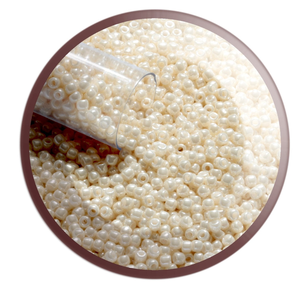 11/0 TR-123 Lt Beige Opaque Luster Round Toho Seed Beads circle white background