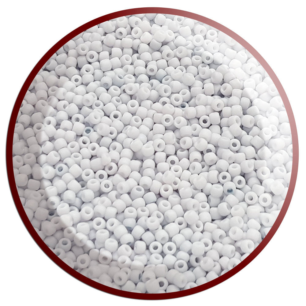 A close-up view of light grey frosted opaque pastel round Toho seed beads. 11/0 Toho Seed Beads,