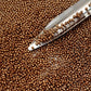11/0 Toho seed beads in medal bronze galvanized permanent finish TR-PF594 with a beading scoop.