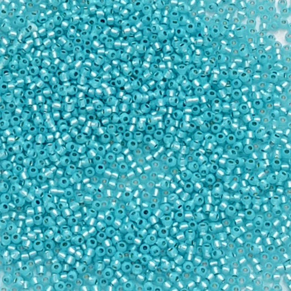 11/0 TR-2117 Milky Aqua Silver Lined Round Toho Seed Beads closeup