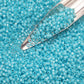 11/0 Toho seed beads in milky aqua silver-lined with a beading scoop.