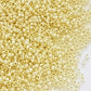 11/0 TR-2125 Milky Jonquil Ceylon Silver Lined Round Toho Seed Beads close up