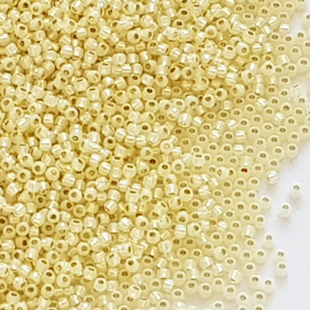 11/0 TR-2125 Milky Jonquil Ceylon Silver Lined Round Toho Seed Beads close up