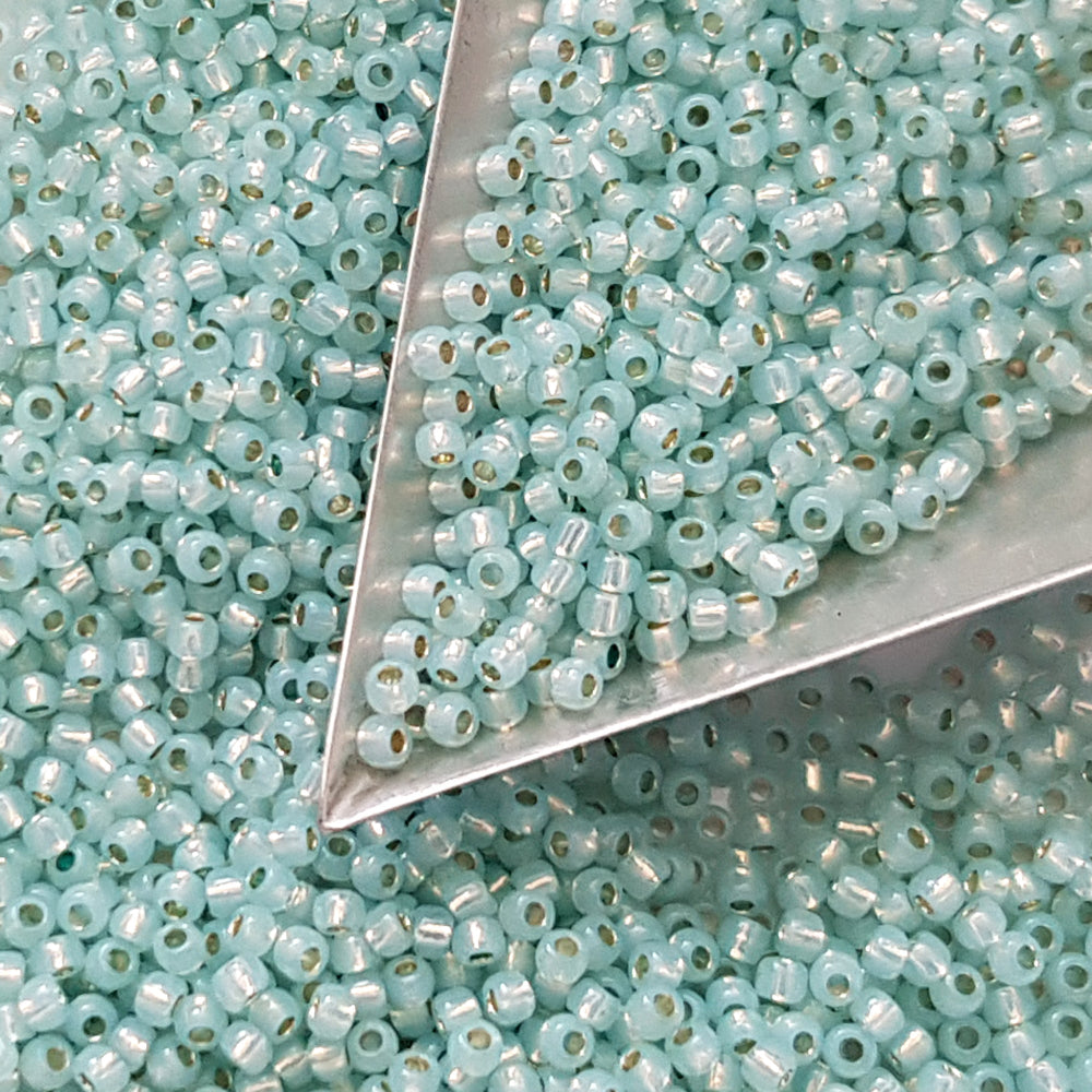 11/0 Milky Aqua Toho seed beads with a triangle scoop.