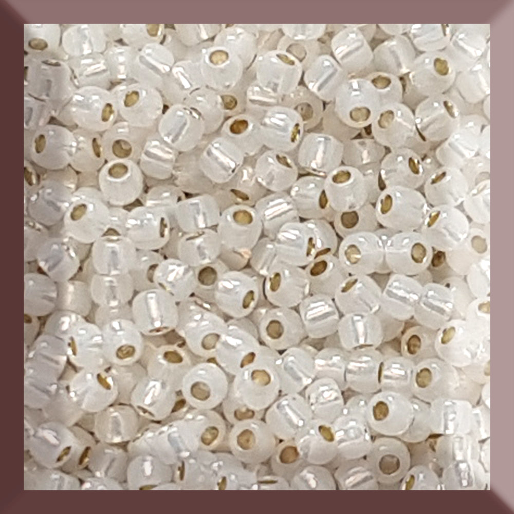11/0 TR-2100 Milky White Silver Lined Round Toho Seed Beads a square window