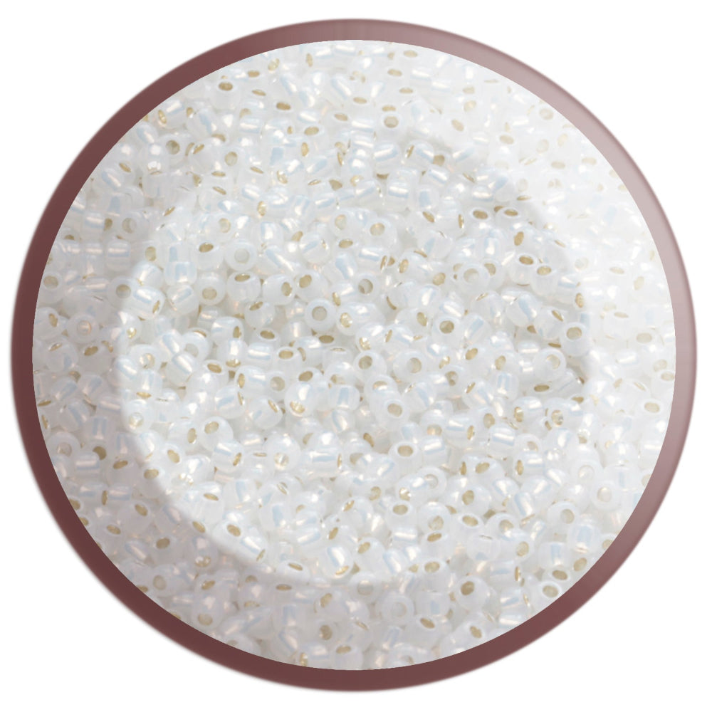 11/0 TR-2100 Milky White Silver Lined Round Toho Seed Beads in a circle white background