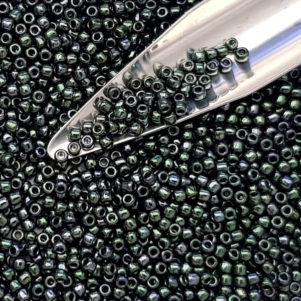 11/0 Toho Seed Beads in Moss Metallic TR-89 with a beading scoop.