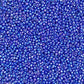 11/0 Toho seed beads in navy blue rainbow opaque close up.