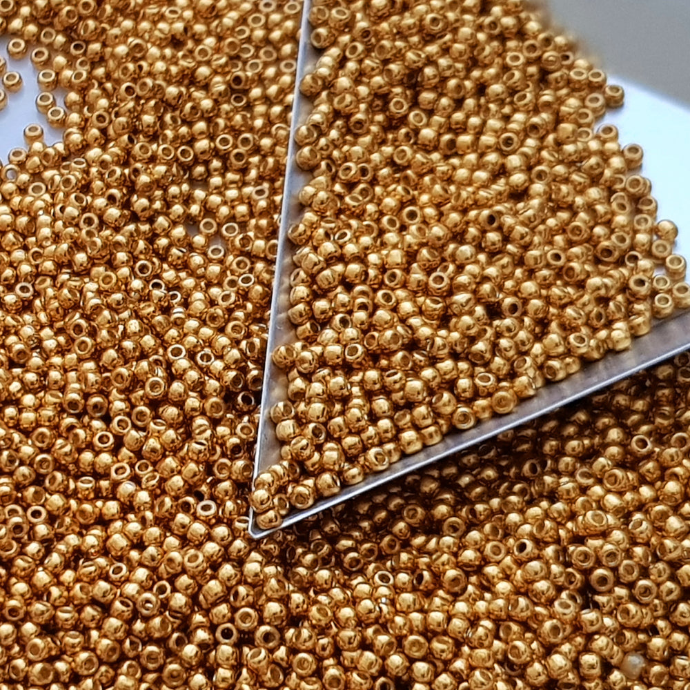 11/0 Toho Seed Beads in Old Gold Permanent Finish TR-PF591 triangle scoop.