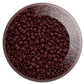 A close-up view of a small pile of round oxblood opaque frosted Toho seed beads.11/0 TR-46F