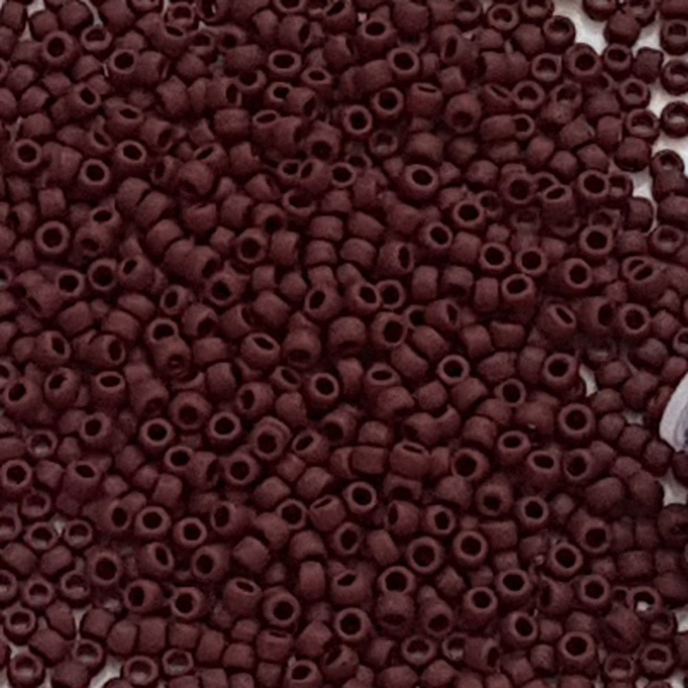 11/0 Toho Seed beads in oxblood frosted opaque TR-46f close up.