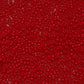 11/0 Toho seed bead in pepper red opaque close up
