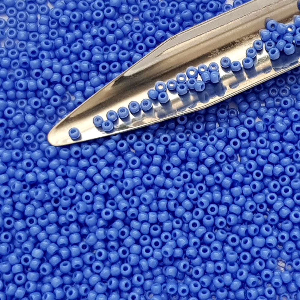 11/0  Toho seed beads in periwinkle blue opaque with a beading scoop.