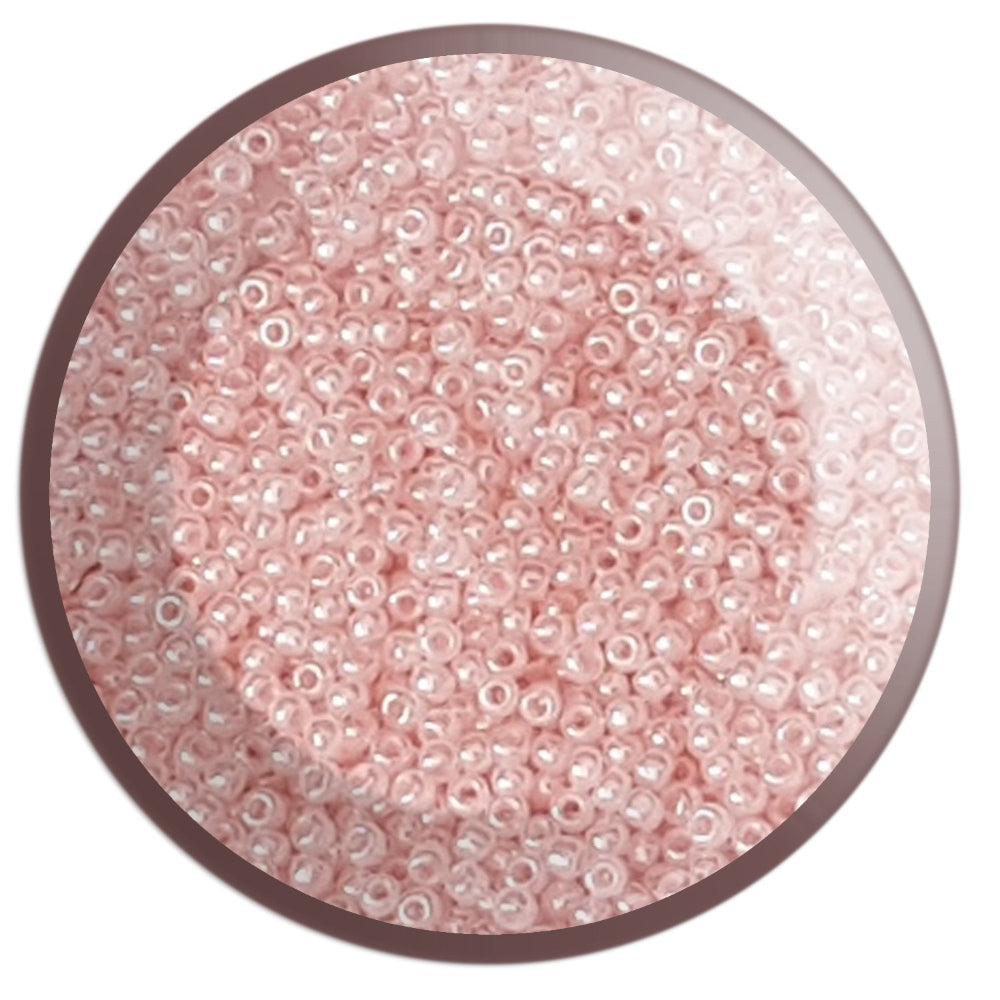 11/0 TR-145 Pink Innocent Ceylon Round Toho Seed Beads circle white background
