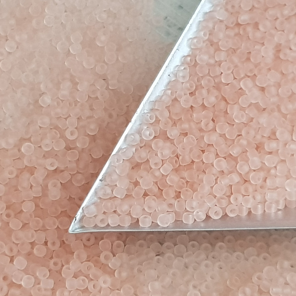 Frosted pink beads 11/0 Toho seed beads with a triangle scoop.