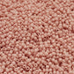 11/0 Toho seed beads in shrimp frosted opaque pastel close up,