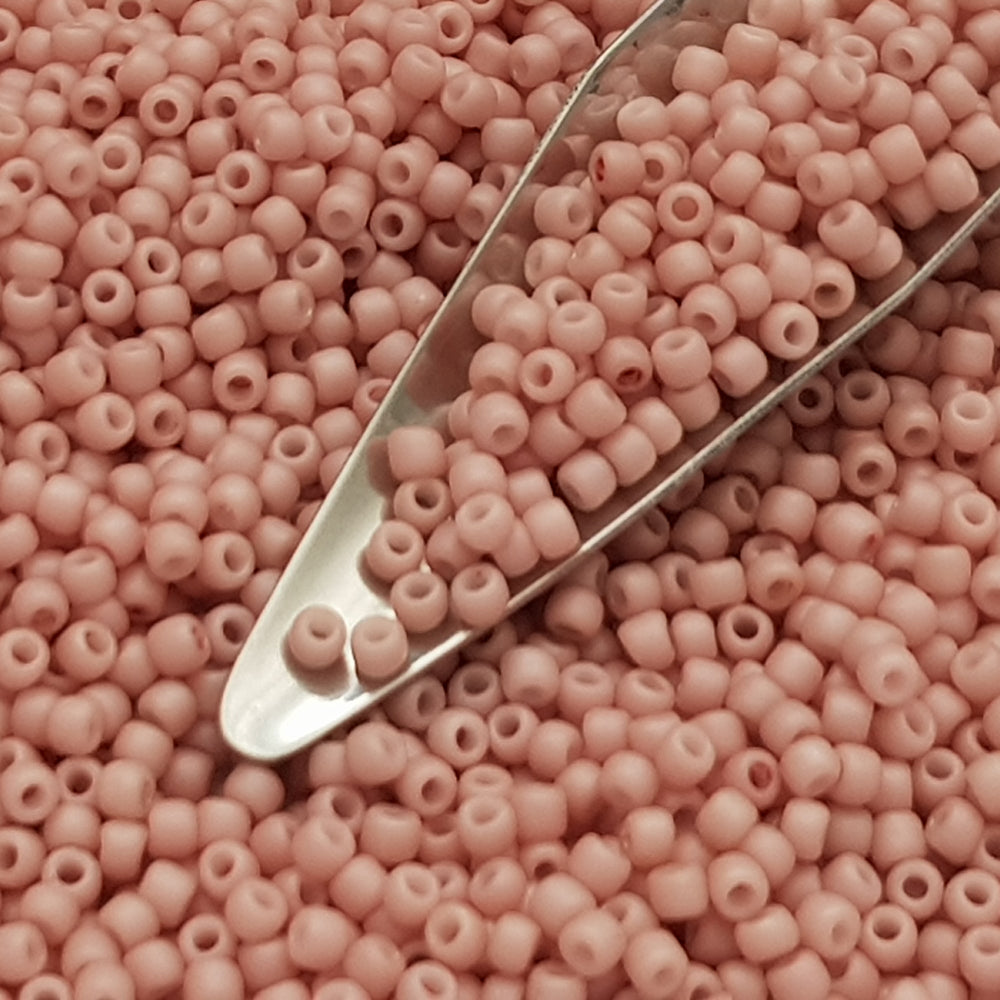 close up shrimp  frosted opaque pastel 11/0 Toho Seed beads with a beading scoop