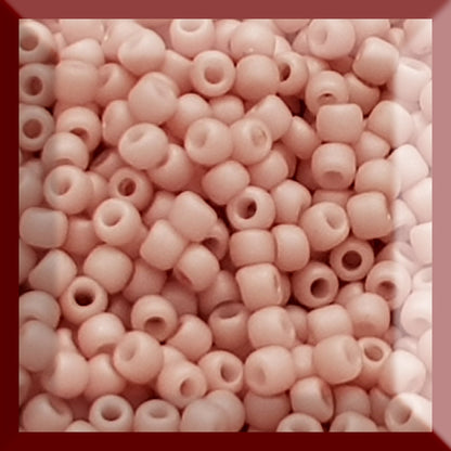 Close shrimp Frosted Opaque Pastel 11/0  Toho beads in a square window.
