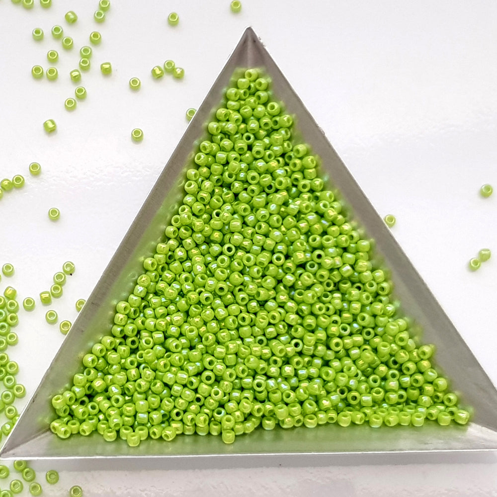 11/0 Toho Seed Beads in Sour Apple Rainbow Opaque TR-404 Triangle scoop.