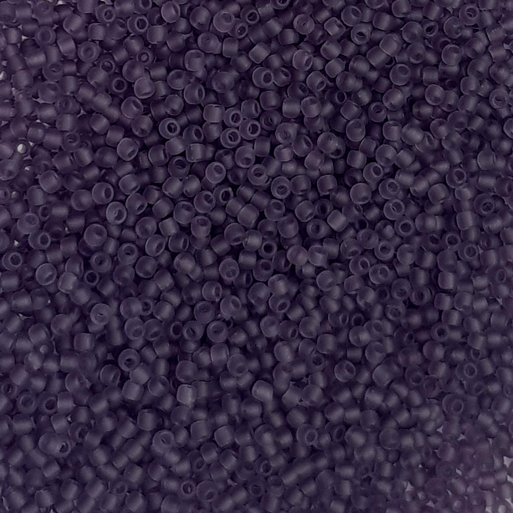 11/0 Toho seed beads in sugar plum frosted transparent in a close up.