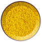 A pack of sunshine yellow, round opaque frosted Toho seed beads 11/0 in a circle white background.