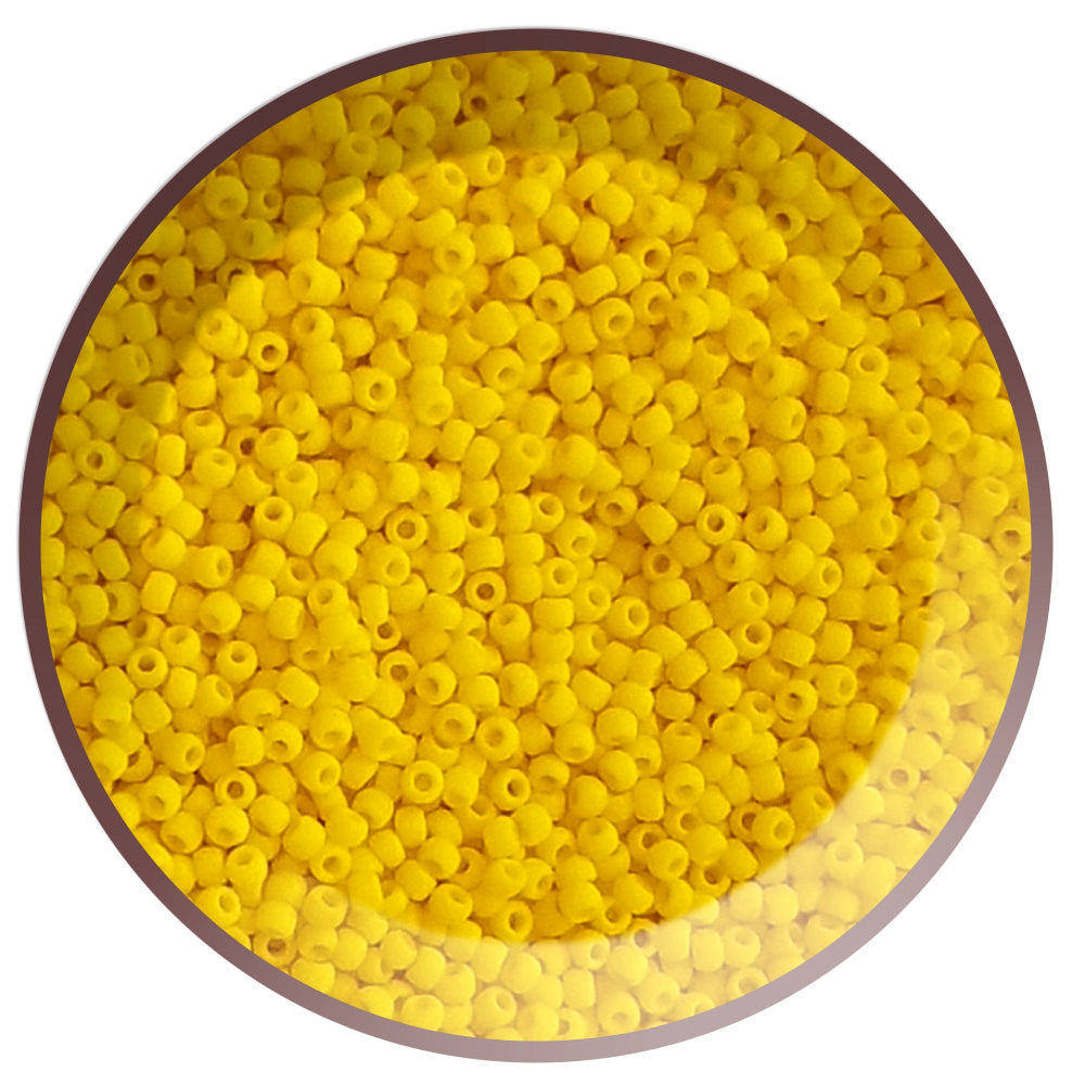 A pack of sunshine yellow, round opaque frosted Toho seed beads 11/0 in a circle white background.