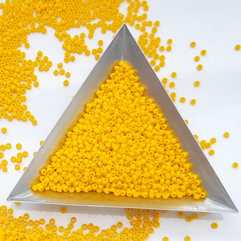 11/0 in sunshine yellow opaque frosted with a triangle scoop.
