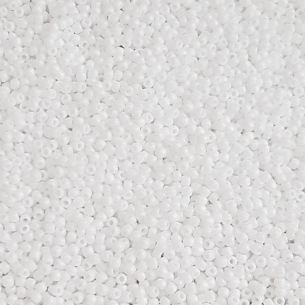 Toho 11/0 White Opaque TR-41 in a close up white background