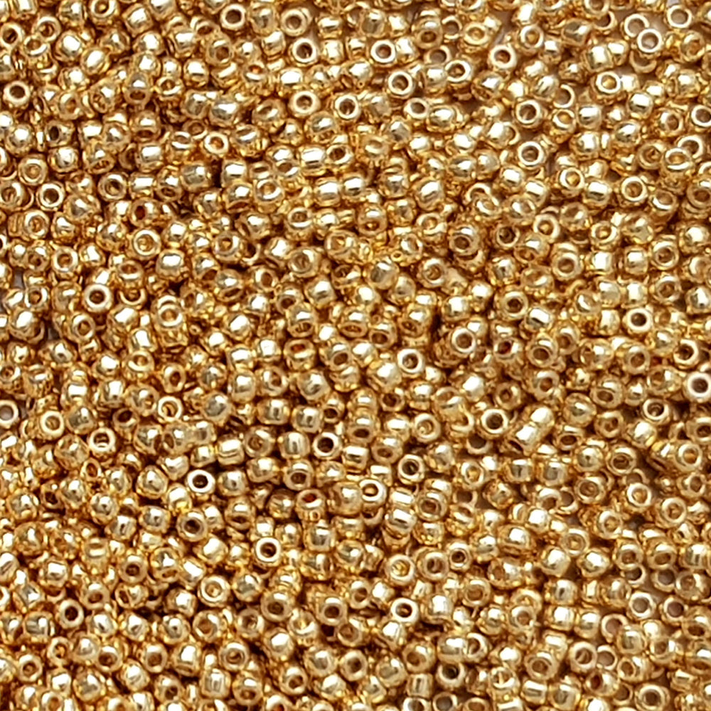 11/0 Toho seed beads in Starlight Gold Galvanized Permanent Finish TR-pf557 close up.