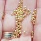 11/0 toho seed beads in starlight gold galvanized permanent finish close up on a hand.