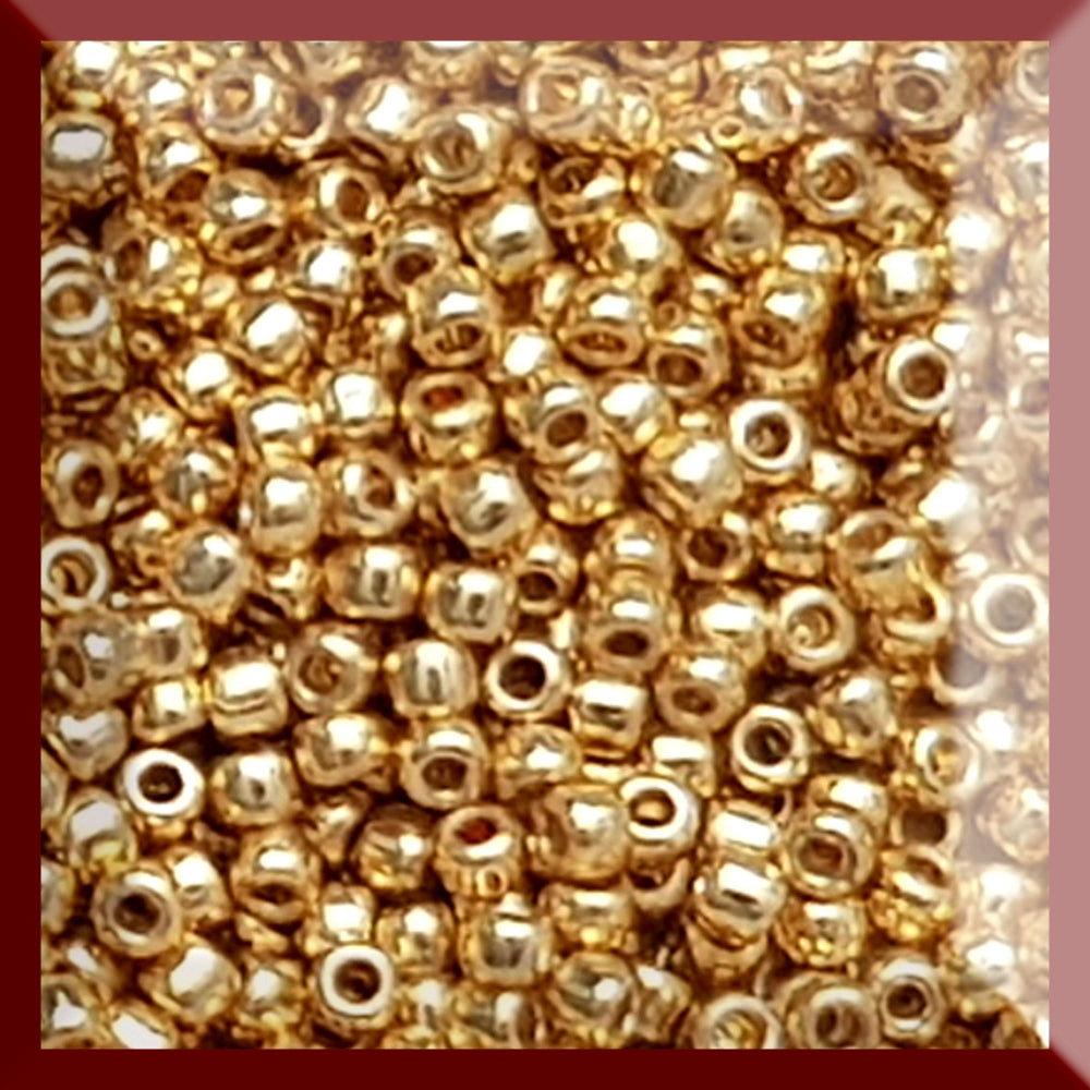 11/0 Toho seed beads in starlight gold galvanized permanent finish TR-PF557 in a square window.