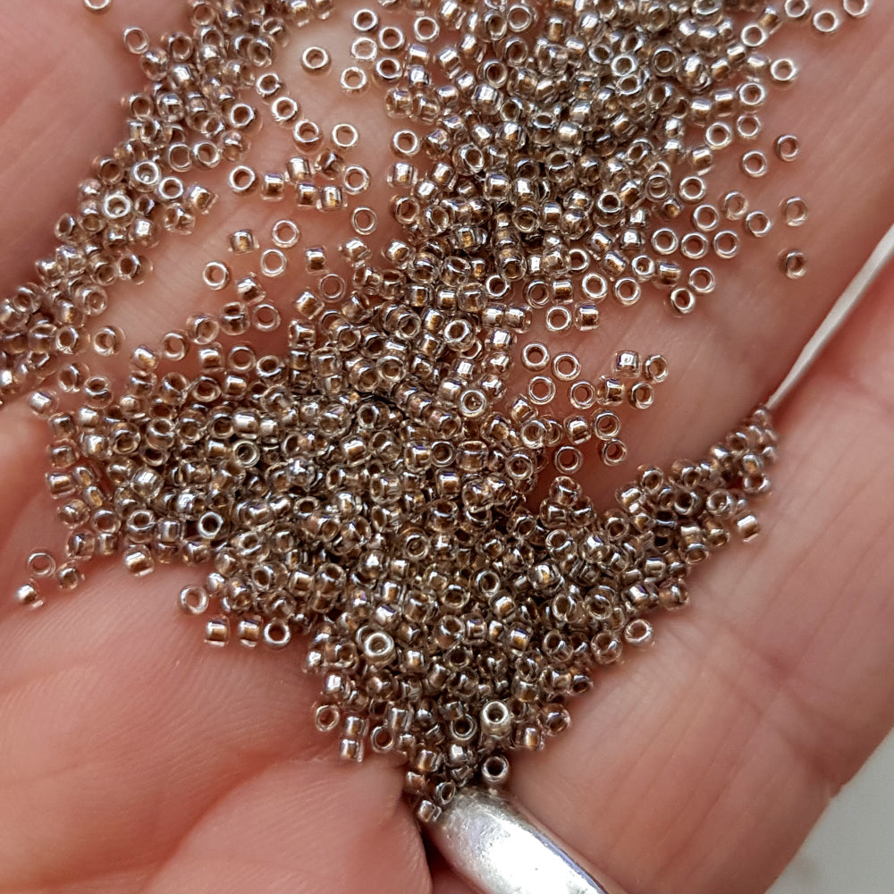 close up of beads on a hand