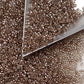 close up crystal beads with a triangle scoop