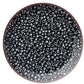 Circle showing close up of haematite metallic beads.