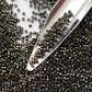 close up beads with beading scoop