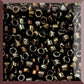 close up beads iris brown metallic