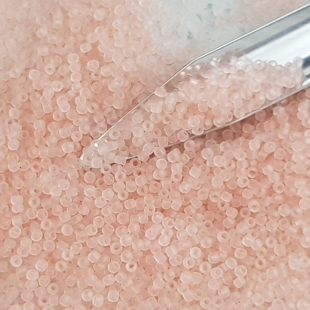 15/0 Toho seed beads in rosaline pink frosted transparent TR-11f with a beading scoop.