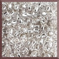 8/0 Toho Seed Beads in Crystal Silver-Lined TR-21 square window.