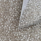 8/0 Toho Seed Bead in crystal silver-lined with a triangle scoop.