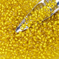 Toho Lemon Frosted Yellow 8/0 Seed Beads TR-32F beading scoop.